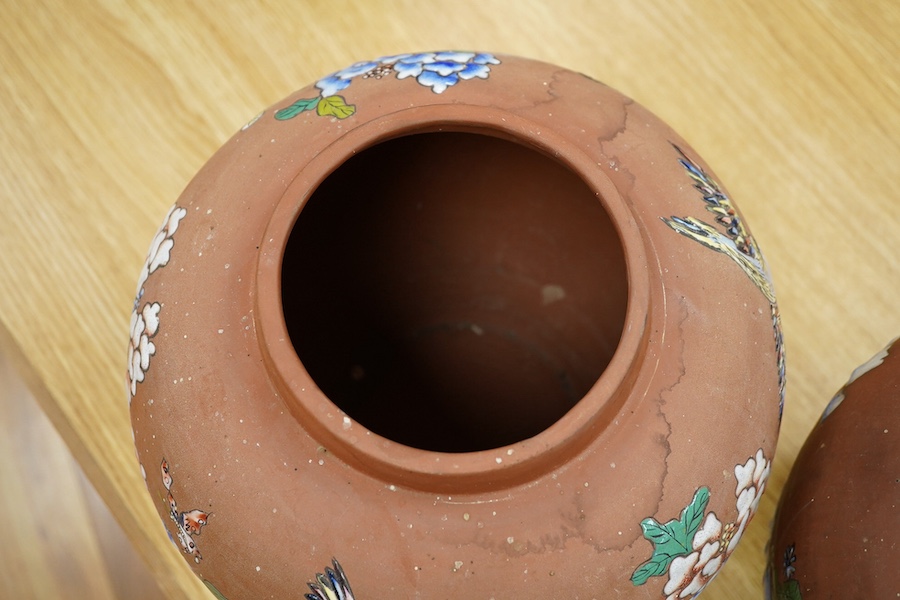 A pair of Japanese enamelled terracotta jars, c.1900, 26cm high. Condition - fair to good